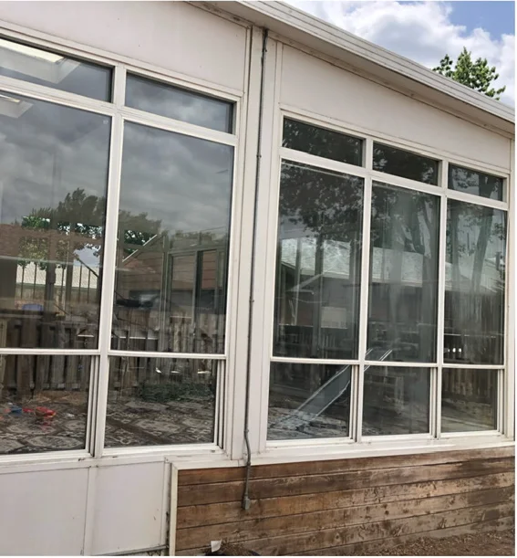 Sunroom window glass viewed from outside after cleaning