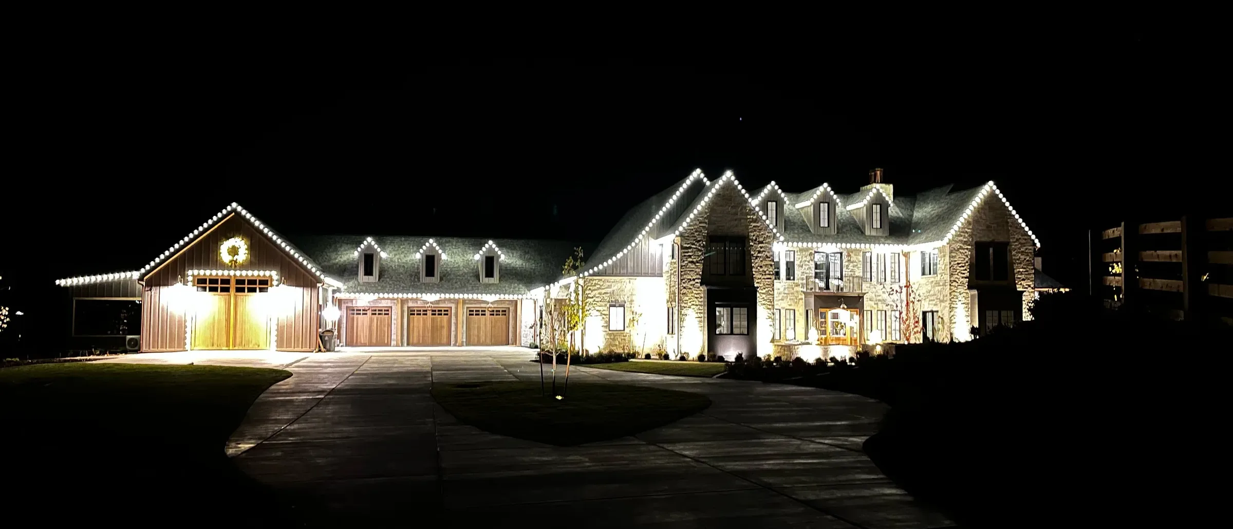 Long ranch home lit end to end at night