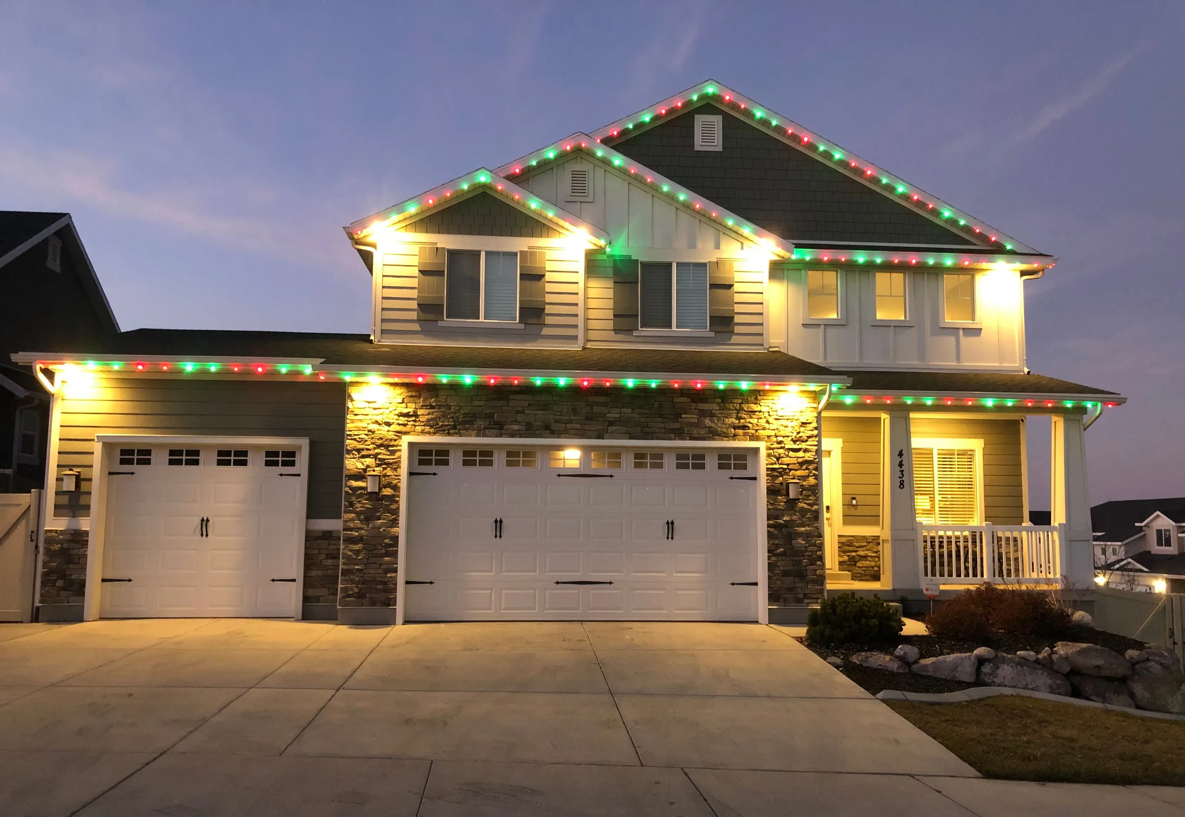 Red, green and white rooflines at twilight