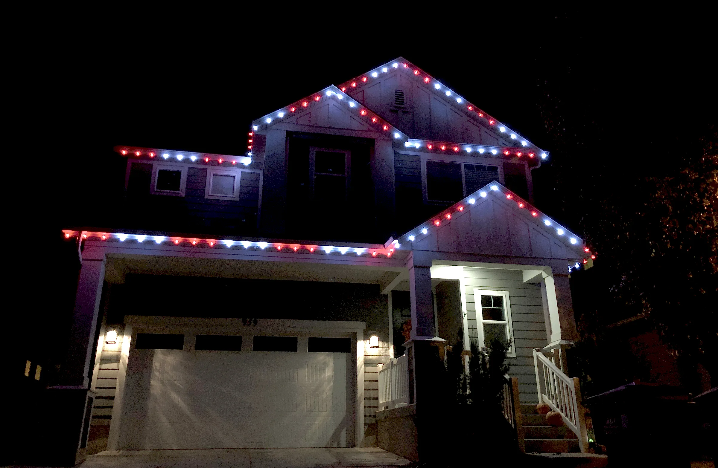 Two-story home with red and white rooflines