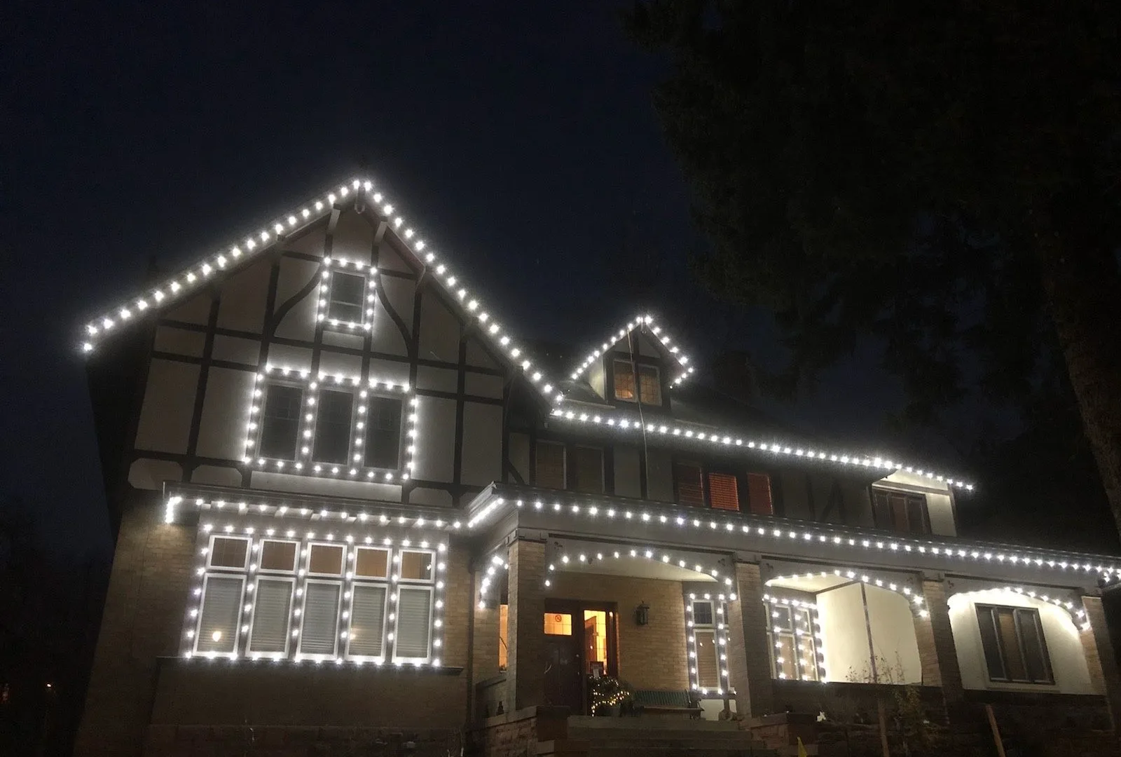 Tudor home with rooflines and windows outlined in white