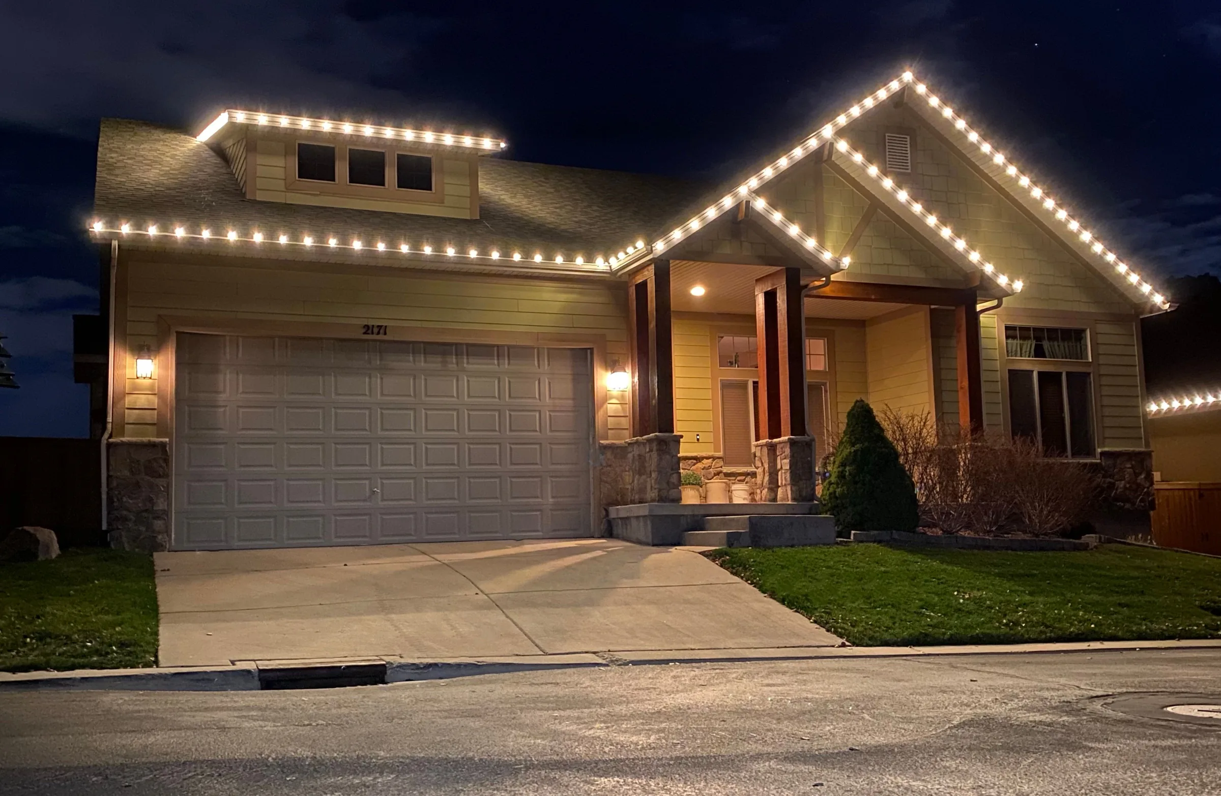 Craftsman home outlined in warm white